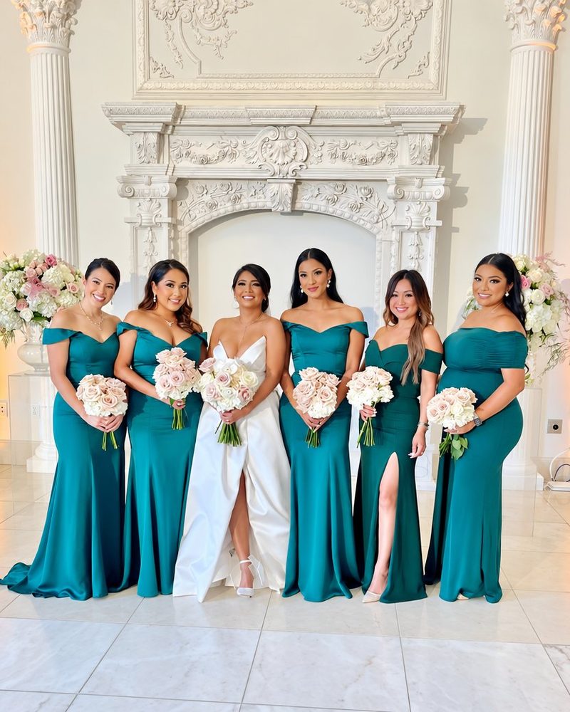 Wedding: the bride and bridesmaids in teal gowns before a carved white fireplace